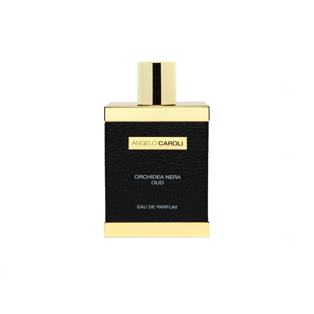 A rectangular black perfume bottle with gold accents and cap, labeled “Orchidea Nera Eau de Parfum - Angelo Caroli” by ANGELO CAROLI. This luxurious woody floral unisex scent is showcased against a white background.