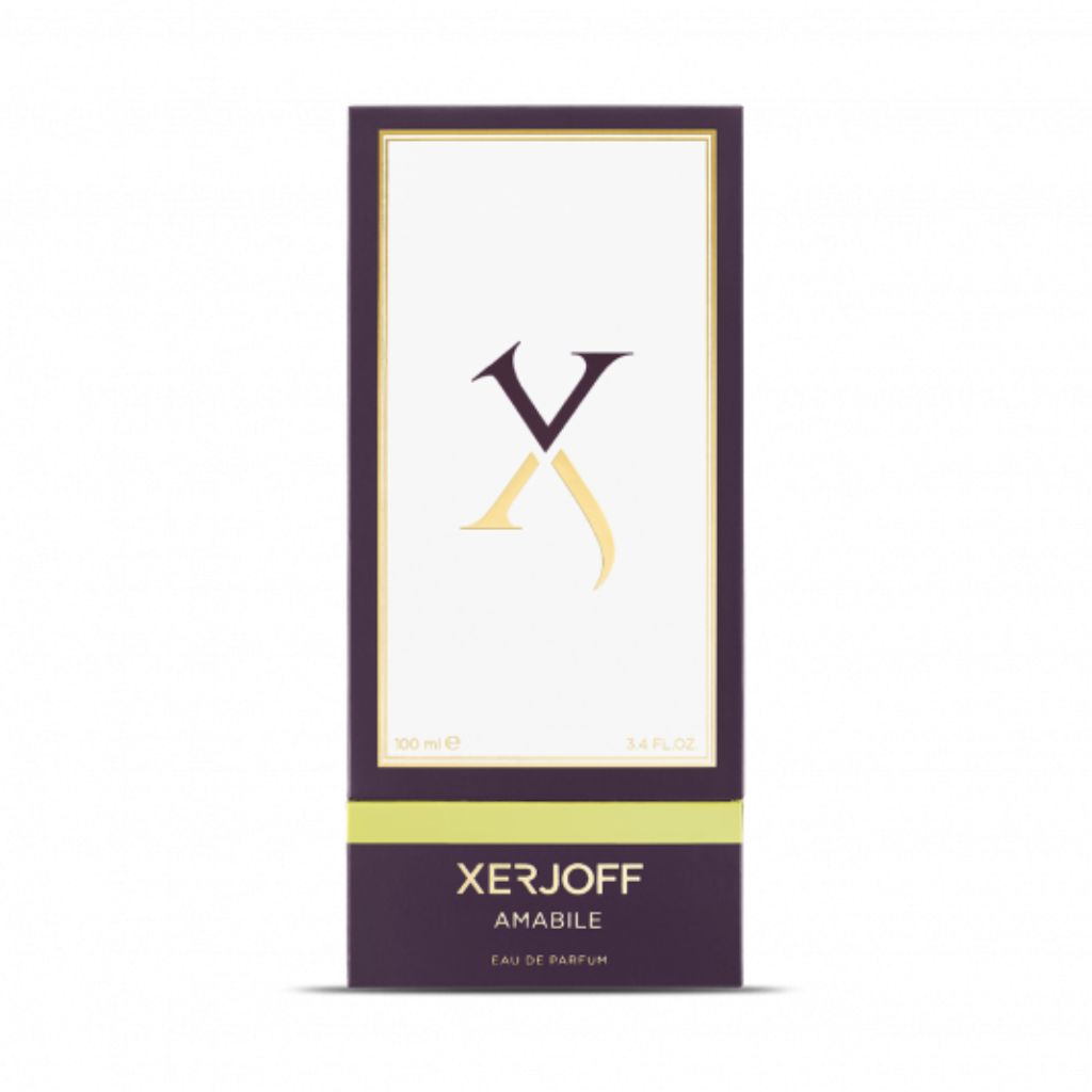 A rectangular box of Amabile Eau de Parfum by XERJOFF, a unisex, woody aromatic fragrance, features a minimalist white and purple design with gold accents and the XERJOFF logo on the front.