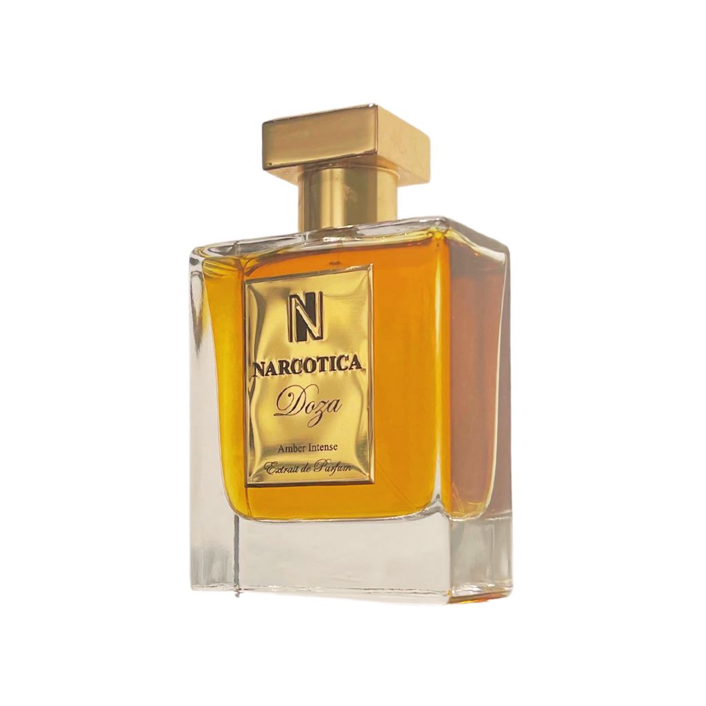 A clear glass bottle with a gold cap, filled with amber liquid. The label reads Doza Eau de Parfum - Narcotica, evoking the allure of Sweet Amber and subtle Blonde Tobacco notes in this unisex fragrance by Narcotica.