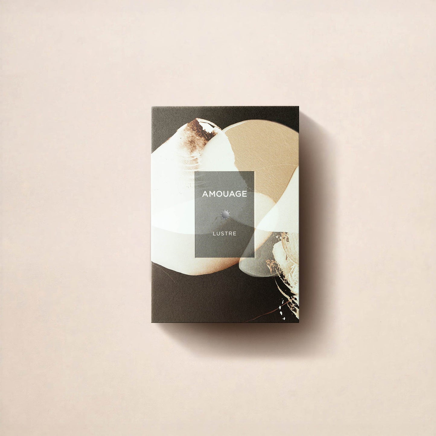 A rectangular Fragrapedia Haus Lustre Essence de Parfum box features abstract beige and brown artwork on a light background, casting a soft right shadow—showcasing its intense, double-infusion sandalwood-inspired fragrance.