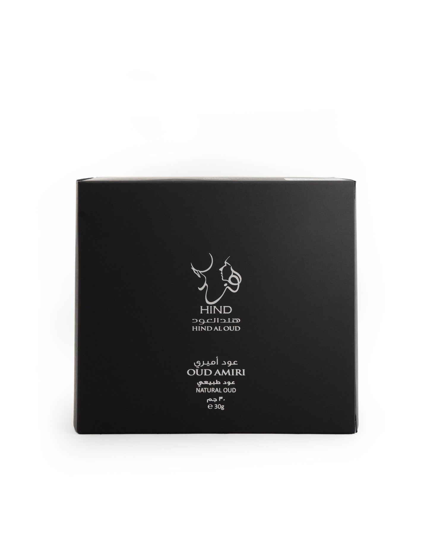 A black square box with white Arabic and English text—Hind Al Oud and Oud Amiri Natural Oud—plus a minimalist animal-heads logo, presents the luxurious scent of premium agarwood from Hind Al Oud.