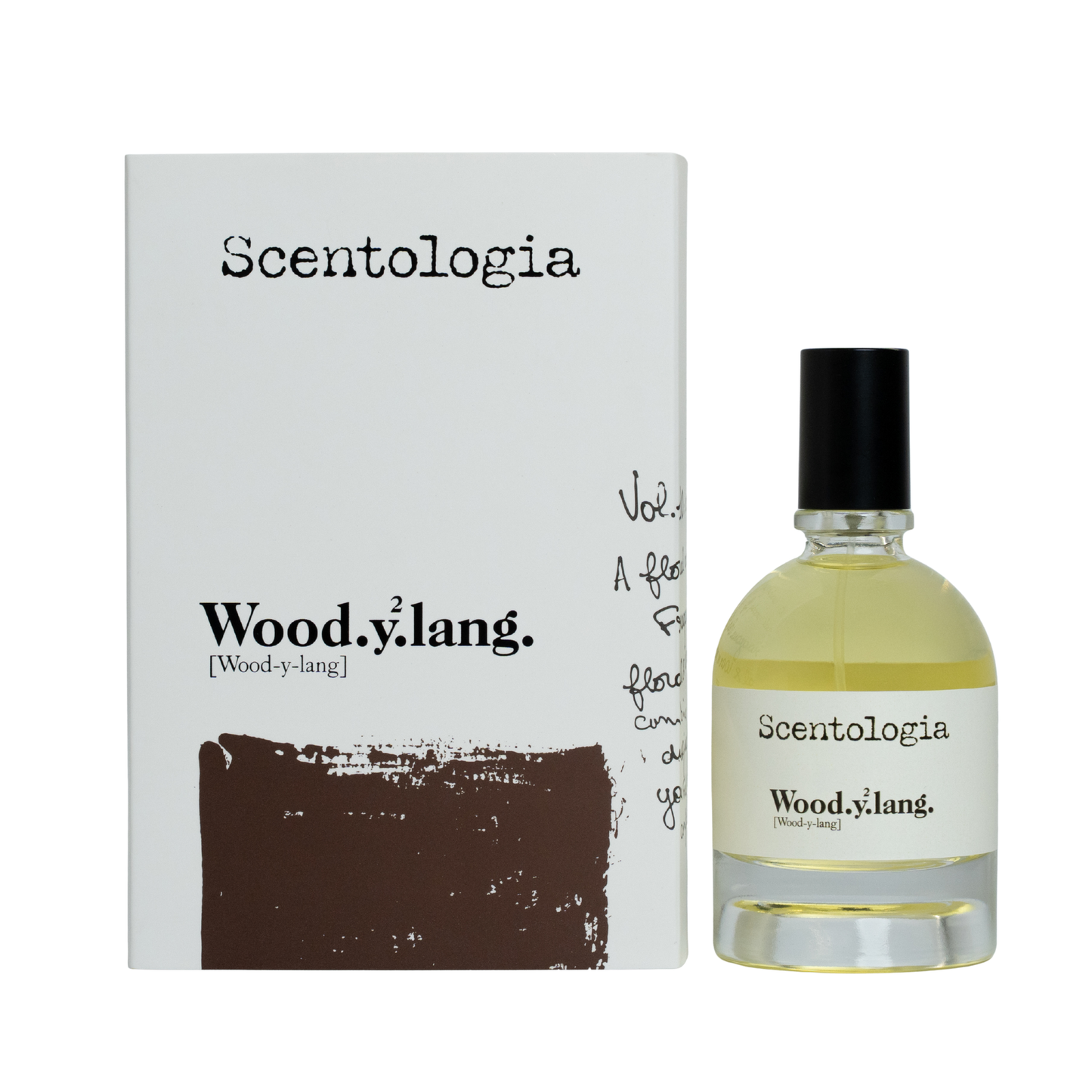 A bottle of Scentologia Woodylang Eau de Parfum with a black cap sits beside its white box, both featuring black and brown accents. Each spritz reveals floral woody notes of jasmine and ylang ylang.