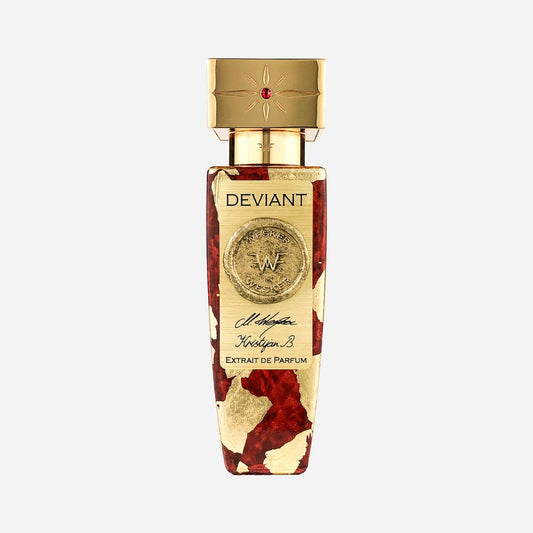 A luxurious Wesker Deviant Eau de Parfum bottle features gold accents, a red and gold marbled base, a gold cap with a red gem, and elegant script—evoking the richness of ylang-ylang and damask rose.