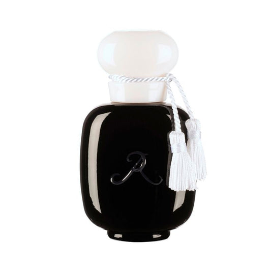ROSE ABSOLUMENT Eau de Parfum by LES PARFUMS DE ROSINE is a black, glossy perfume bottle with a white rope-adorned cap and two white tassels, featuring an "R" on the front. The bottle sits against a white background.