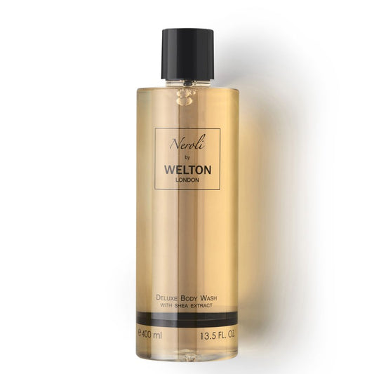 A 400 ml clear bottle of Welton London NEROLI DELUXE BODY WASH WITH SHEA EXTRACT, made in France for sensitive skin; features golden liquid, a black cap, and black label text.