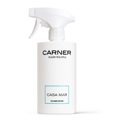 A white spray bottle from GIFTS, labeled CASA MAR Sea Room Perfume - Carner Barcelona, features a minimalist blue-bordered design and a fresh Mediterranean scent—ideal for fans of sophisticated Room Perfumes.