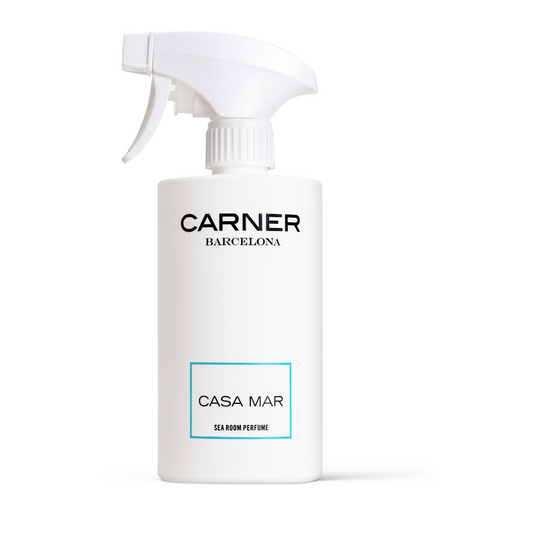 A white spray bottle from GIFTS, labeled CASA MAR Sea Room Perfume - Carner Barcelona, features a minimalist blue-bordered design and a fresh Mediterranean scent—ideal for fans of sophisticated Room Perfumes.