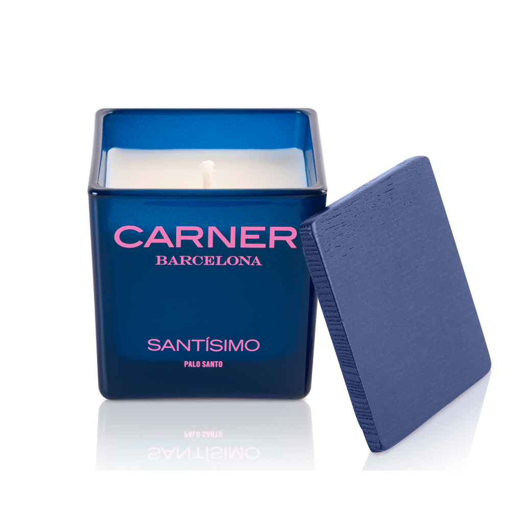 A blue square SANTÍSIMO CANDLE by Carner Barcelona, featuring a matching blue lid, sits on a white background.