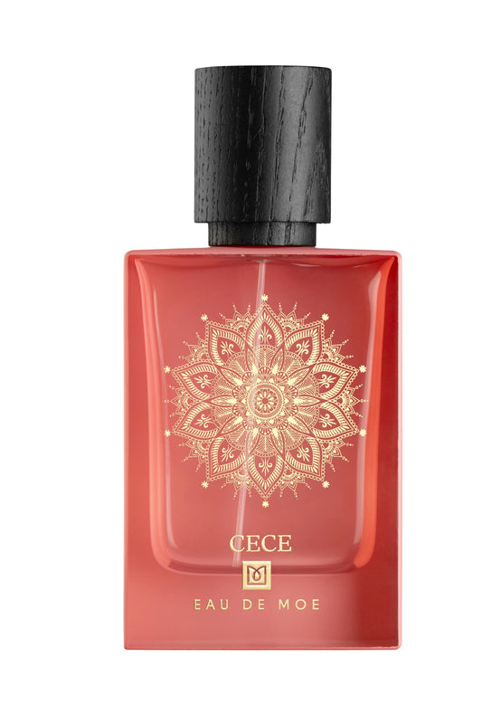 The CECE Eau de Parfum by Eau De Moe is a red bottle with a gold mandala design and textured black cap, making this women’s fragrance striking.