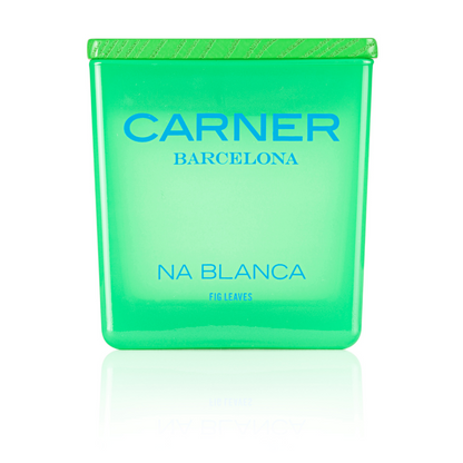 A vibrant green NA BLANCA CANDLE by Carner Barcelona for GIFTS, featuring "Fig Leaves" at the base, a textured cap, and a reflective surface beneath—evoking the fresh scent of a fig tree.