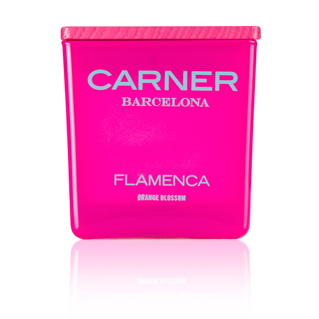 A bright pink rectangular FLAMENCA CANDLE by GIFTS, inspired by Carner Barcelona, with a matching pink lid and bergamot accents, stands against a white background.