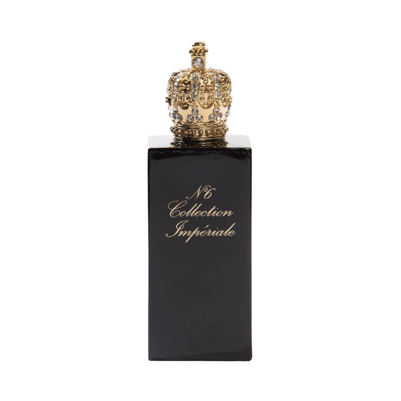 A black perfume bottle labeled "N°6 Eau de Parfum" in gold, crowned with an ornate jeweled cap. Prudence Perfumes' creation holds a sweet oriental scent, reminiscent of Collection Impériale.