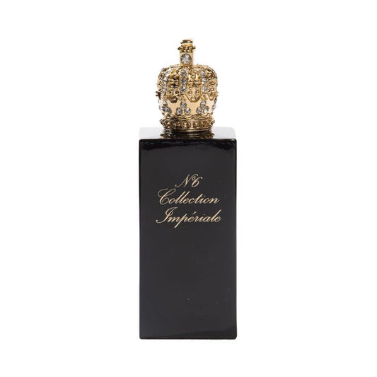 A black perfume bottle labeled "N°6 Eau de Parfum" in gold, crowned with an ornate jeweled cap. Prudence Perfumes' creation holds a sweet oriental scent, reminiscent of Collection Impériale.