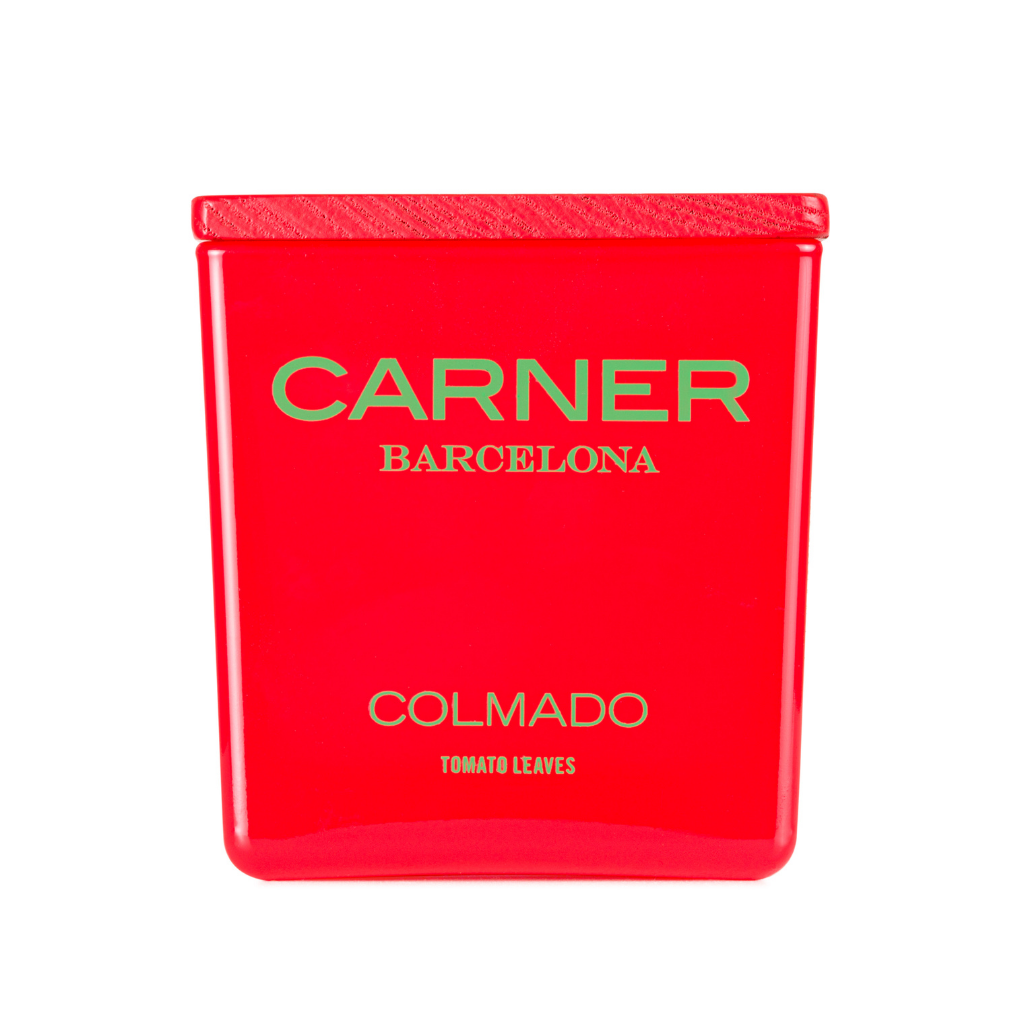 A vibrant red rectangular COLMADO CANDLE by GIFTS, inspired by colmados, with a matching textured cap and gold label text.