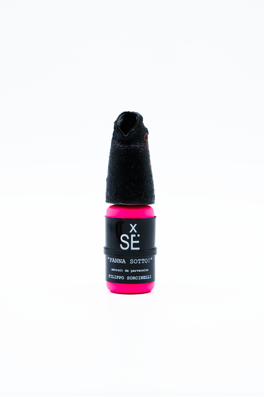 Small bottle with black cap and pink base on a white background