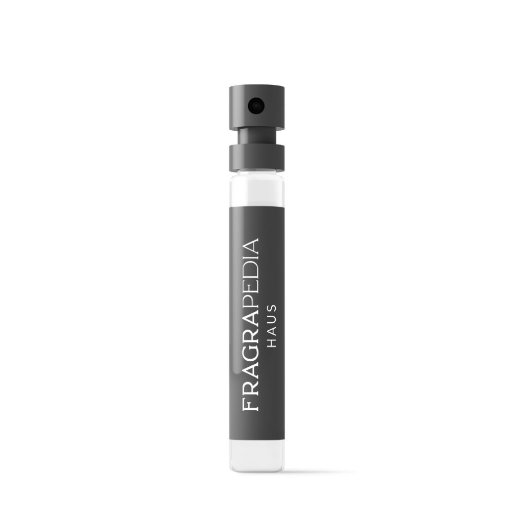A small, clear glass sample vial of CUIRS Eau de Parfum by Carner stands upright on a white background, with a black spray cap and a gray label that reads FRAGRAPEDIA HAUS in white letters.