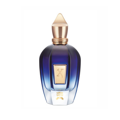 A blue and gold luxury bottle with a geometric gold-tipped cap and label displays the XERJOFF logo and "Comandante Eau de Parfum," featuring an elegant, faceted design for this exquisite tobacco fragrance.