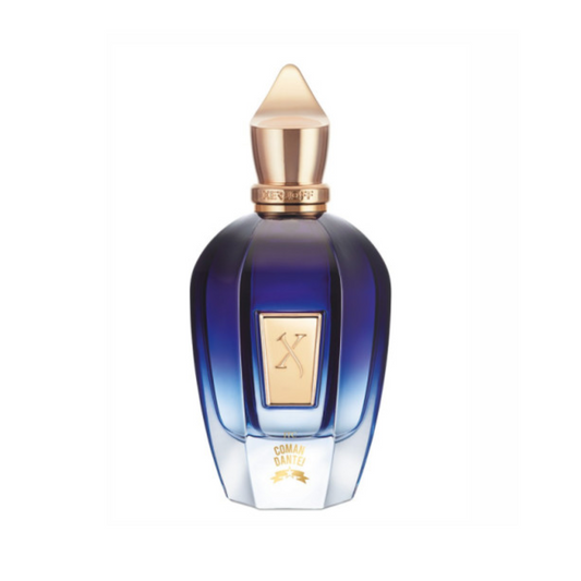 A blue and gold luxury bottle with a geometric gold-tipped cap and label displays the XERJOFF logo and "Comandante Eau de Parfum," featuring an elegant, faceted design for this exquisite tobacco fragrance.