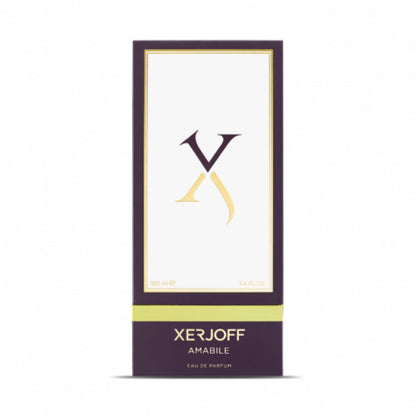 A rectangular box of Amabile Eau de Parfum by XERJOFF, a unisex, woody aromatic fragrance, features a minimalist white and purple design with gold accents and the XERJOFF logo on the front.