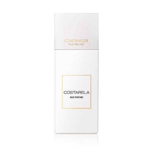 A white rectangular bottle of GIFTS COSTARELA HAIR PERFUME with a wood-textured cap and minimalist gold and black text sits against a plain white background, showcasing this long-lasting Mediterranean scent hair mist.