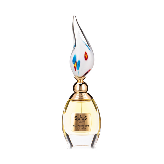 A bottle of MOI AMOROSO Eau de Parfum by Salas Art Perfumes features a gold cap, artistic glass stopper with blue and red accents, and golden-yellow floral fragrance with vanilla musk. Comes in a wooden box.