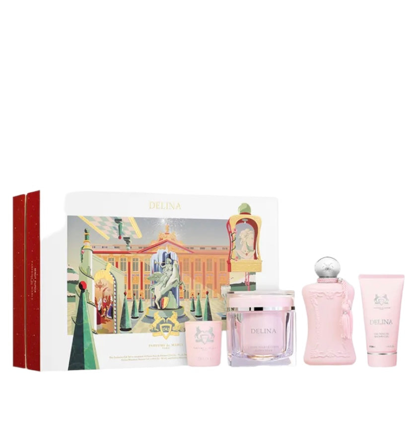 The Parfums de Marly Delina Gift Set features feminine, floral-scented fragrance and body products in pink packaging, including a perfume bottle, cream jar, and tube with illustrated grand building and statue design.