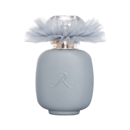 A matte light grey BALLERINA N°2 Eau de Parfum bottle by LES PARFUMS DE ROSINE with a translucent cap, sheer grey tulle bow, and embossed "R," hinting at the woody floral scent inside.