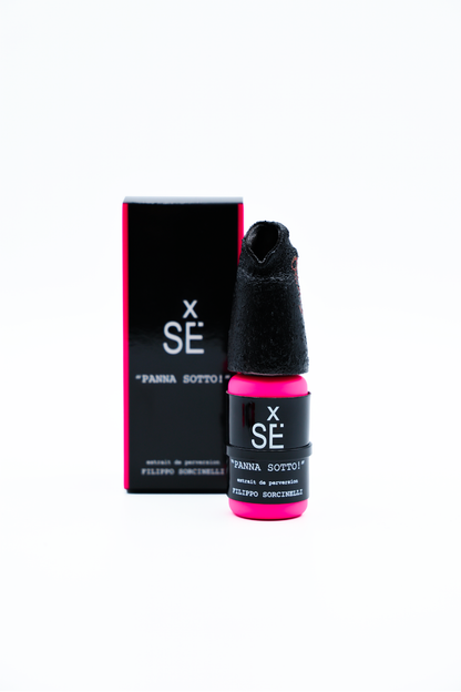 Black and pink bottle with packaging on a white background
