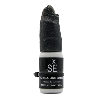 X SÉ QUICKIE AND COFFEE Eau de Parfum by Filippo Sorcinelli features a sculpted black cap resembling a finger—a bold, intense fragrance from the XSÉ collection.