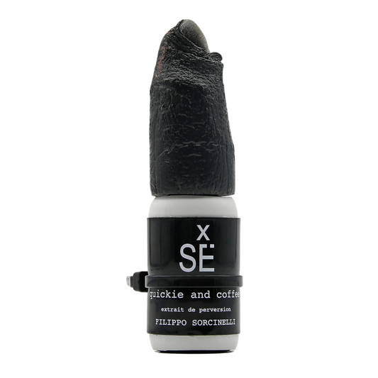 X SÉ QUICKIE AND COFFEE Eau de Parfum by Filippo Sorcinelli features a sculpted black cap resembling a finger—a bold, intense fragrance from the XSÉ collection.