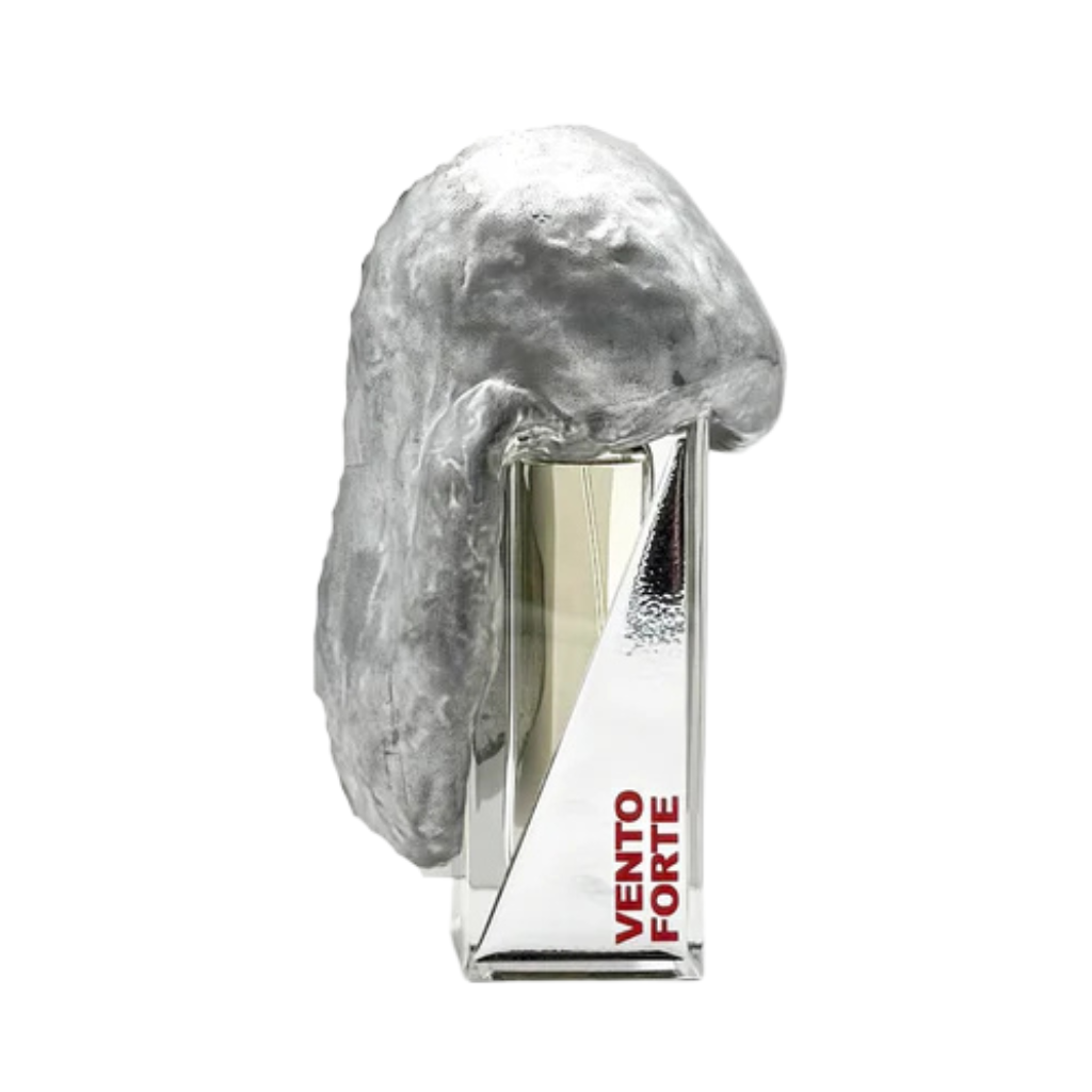 A clear, rectangular bottle labeled VENTO FORTE “strong wind” Eau de Parfum by Filippo Sorcinelli features a striking silver sculpture, capturing a scent of liberation inspired by the Exodus narrative.