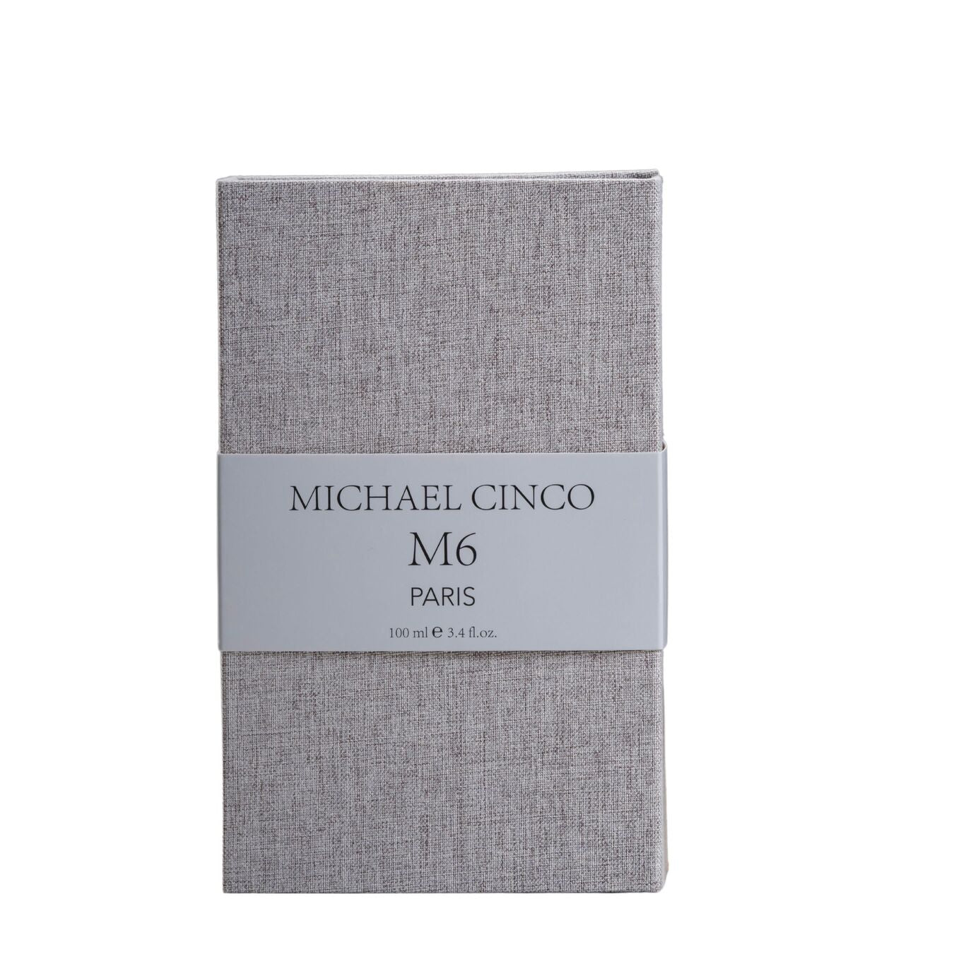 A rectangular, textured grey box with a band label reading M6 Eau de Parfum - Michael Cinco by Fragrapedia Haus, 100 ml (3.4 fl.oz.), in black text, suggesting sophisticated oud notes within.