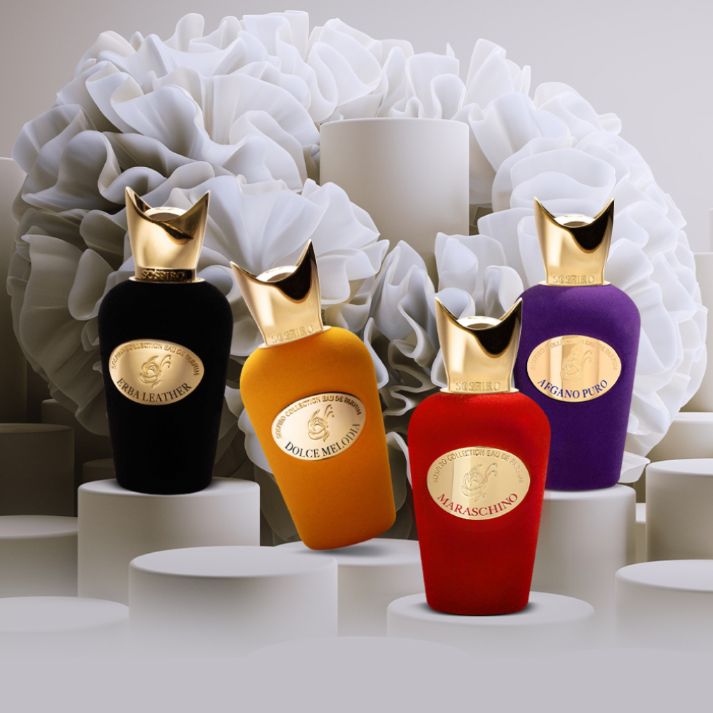 Four luxurious Afgano Puro Eau de Parfum bottles by SOSPIRO in black, orange, red, and purple with gold caps stand on elegant white pedestals against an abstract floral background, evoking the rich allure of a jazz club.