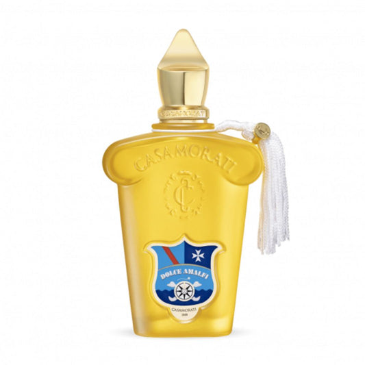 A gold Casamorati 1888 Dolce Amalfi Eau de Parfum bottle by XERJOFF features a pointed cap, white tassel, blue and red crest label, embossed details, and decorative accents, reflecting its luxurious oriental spicy fragrance.