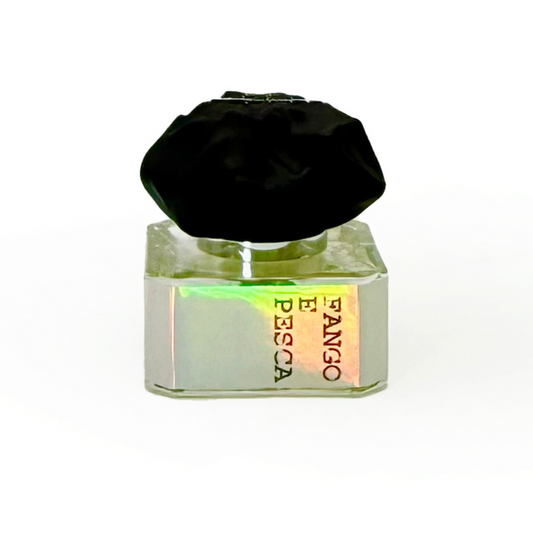 A glass bottle with a shiny silver "FANGO E PESCA" label, bold black cap, and SuperFluo fragrance notes: SUPERFLUO FANGO E PESCA "Mud and Fishing" Eau de Parfum by Filippo Sorcinelli against a white background.