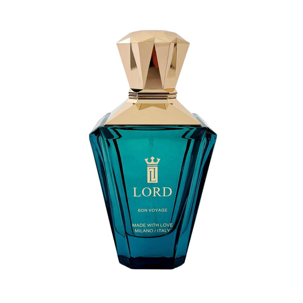 A teal faceted bottle of BON VOYAGE Eau de Parfum by LORD MILANO, with a gold geometric cap and crown logo. From the DREAM LIBRARY Collection, its luxury design is inspired by sandalwood and pink pepper notes. Made in Milano, Italy.