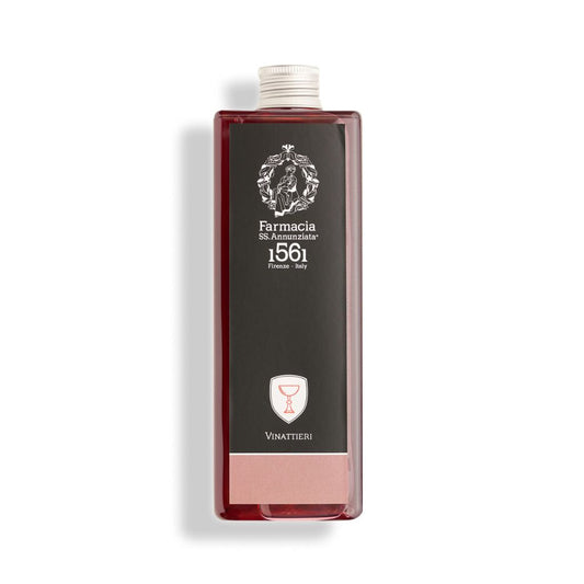 The Vinattieri REFILL by Farmacia SS. Annunziata 1561 comes in a rectangular bottle with a dark label featuring a white crest, red wine glass icon, and captures the pleasant scent of Florentine wine.