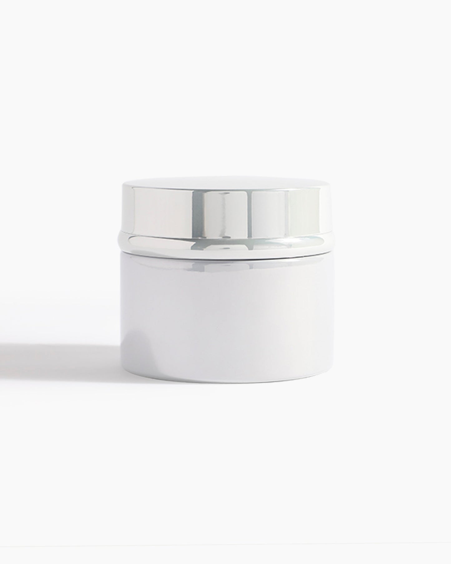A sleek white jar with a shiny silver lid from Hind Al Oud, perfect for holding Pink Smoke Dokhoon—an elegant offering by Hind Al Oud—against a clean white background.