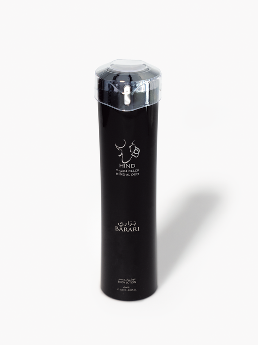 A tall, sleek black bottle of Barari Body Lotion by Hind Al Oud with a clear cap and silver logo stands upright on a white background, evoking the allure of Arabian Desert perfume.