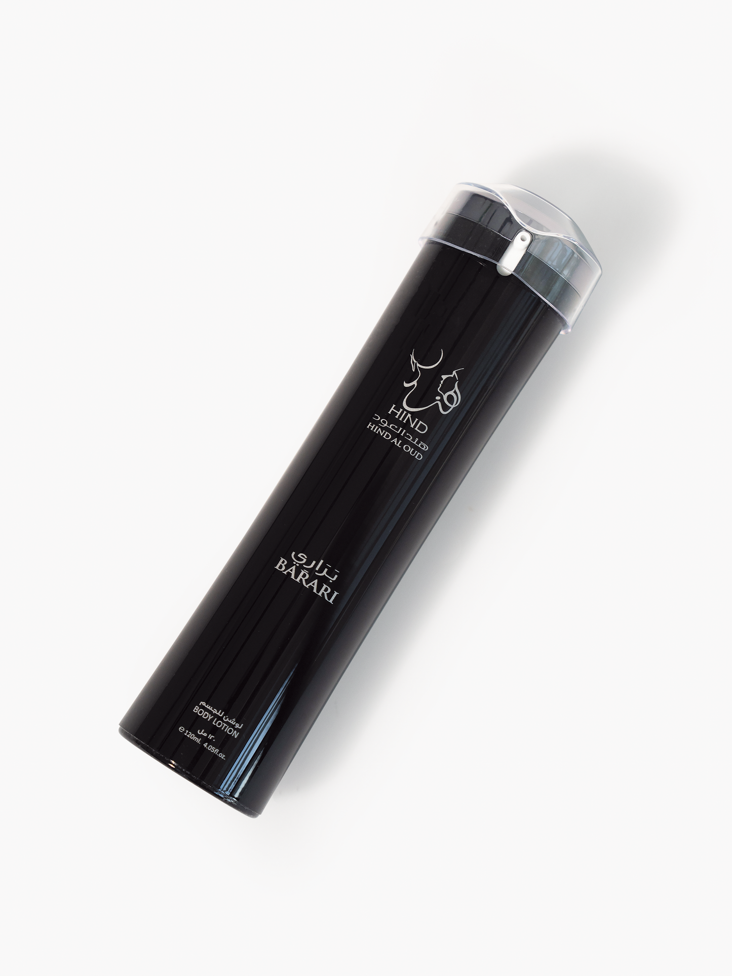 A tall, black cylindrical body lotion bottle labeled Hind Al Oud Barari with white Arabic and English text, a silver cap, and a minimalist deer logo evokes the essence of Barari Body Lotion, photographed on a white background.