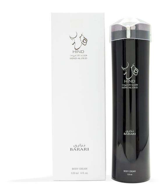 A tall black bottle and a white box of Hind Al Oud Barari Body Lotion, inspired by the Arabian Desert collection, display gold and white Arabic and English text. The bottle contains 120 ml (4 fl. oz.) of lotion.