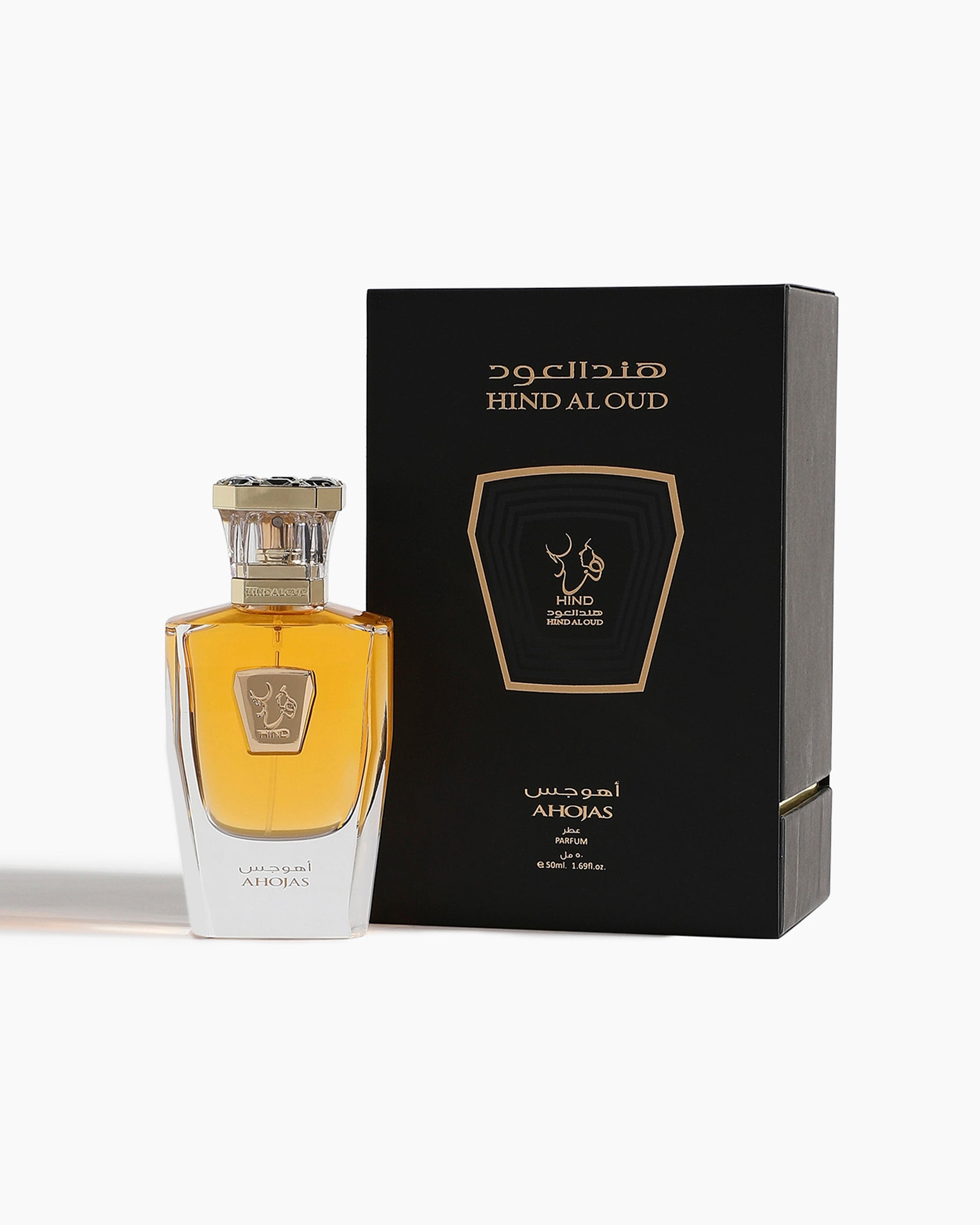 Ahojas Parfum by Hind Al Oud, featuring fig and tobacco notes, is shown beside its black and gold box with Arabic and English text on a white background.
