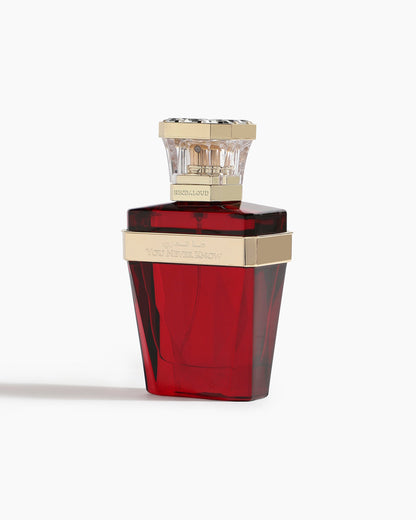 A red, faceted bottle with a gold band and clear cap, engraved with “You Never Know,” holds Hind Al Oud’s You Never Know Parfum. This elegant design hints at its luxurious essence. The bottle is displayed on a white background.