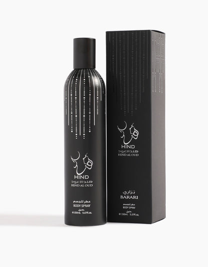A 150ml black cylindrical bottle of Hind Al Oud's Barari Body Spray stands by its matching box, both adorned with white lines and English-Arabic text. Infused with agarwood, it emanates timeless elegance.