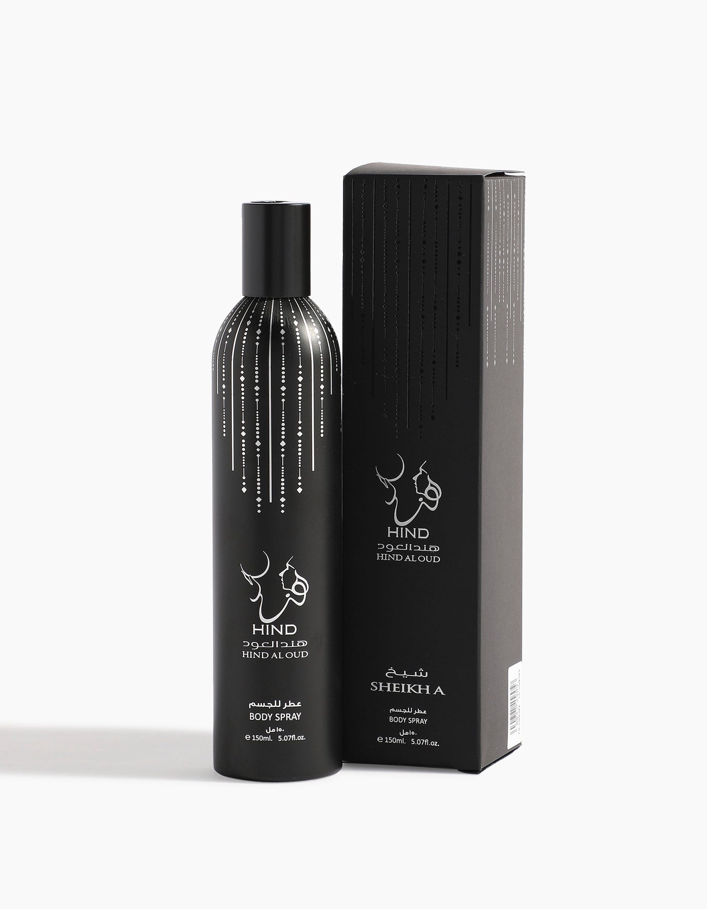 A black bottle of Hind Al Oud Sheikh A Body Spray - Hind Al Oud, with rich agarwood and spices, sits beside its matching black box, both adorned with silver dots and Arabic and English text.