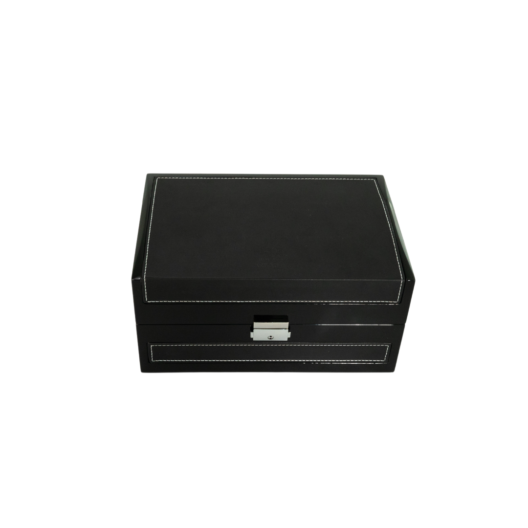 A black rectangular box with white stitching and a silver latch, ideal for gifting the Ahojas Collection Shield Edition Gift Box by Hind Al Oud, is shown against a plain white background.