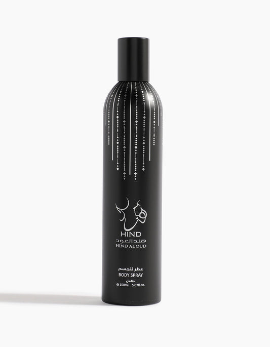 Ahojas Body Spray by Hind Al Oud comes in a tall black cylindrical bottle with fig, tobacco, and honey notes, white dotted accents from the top, and a minimalist white logo and text in English and Arabic on the front.