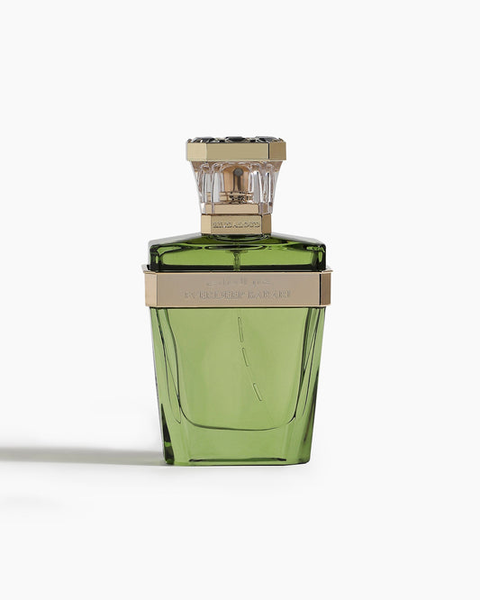 The Everdeep Barari Parfum by Hind Al Oud, a green glass bottle with gold accents and a clear faceted cap, stands upright on a white background, evoking the woody scent of patchouli.