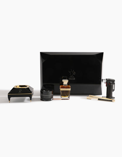 The Diamond Incense Kit Gift Box Option B by Hind Al Oud is a luxury black set with a rectangular box, ashtray, jar, torch lighter, two wooden sticks, and a gold-accented Sheikh A Oud perfume bottle displayed on white.