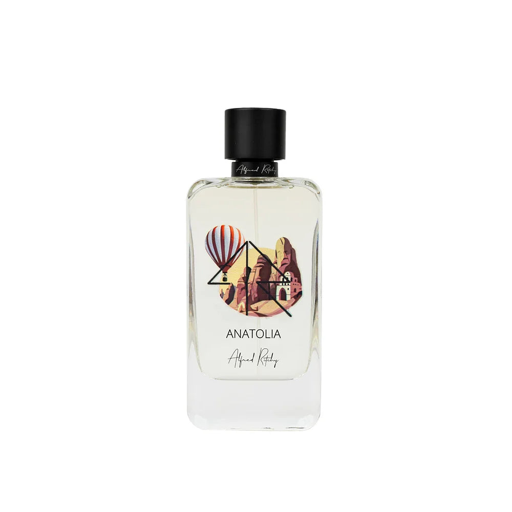The ANATOLIA Eau de Parfum by Alfred Ritchy is a 100ml clear bottle decorated with hot air balloons and rocky landscapes; its minimalist look and black cap evoke the vanilla sandalwood scent inside.